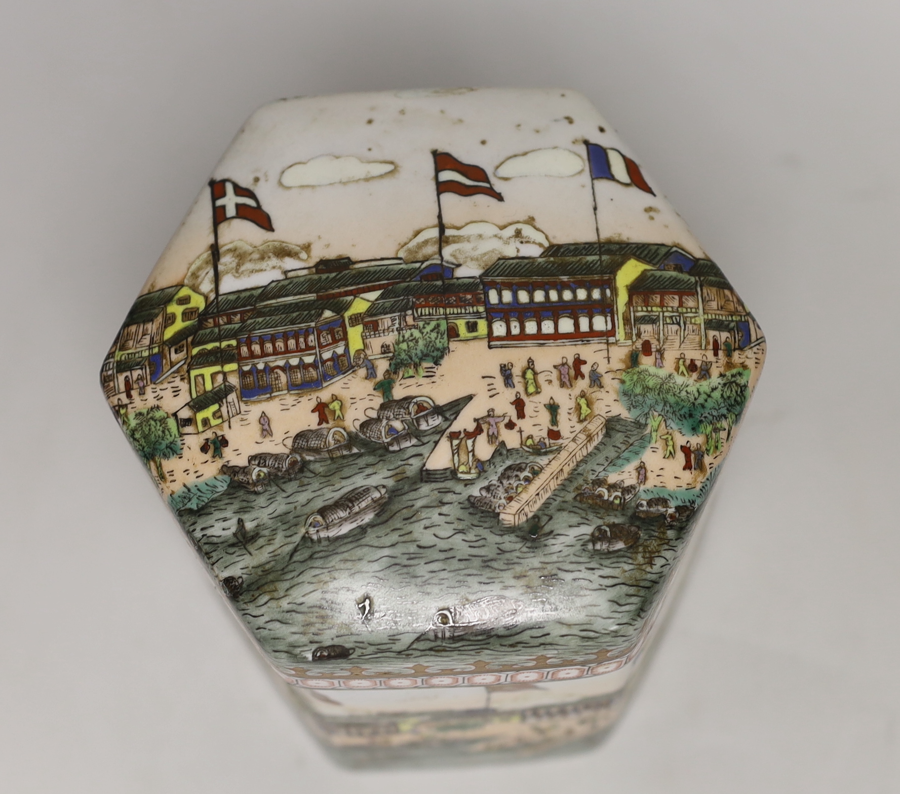 A Chinese hexagonal tea canister, decorated with the Hongs of Canton, 17cm